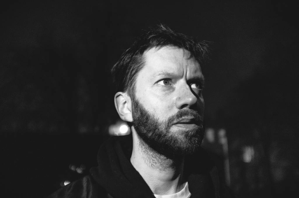 Headshot of music producer Lamplighter in black and white.